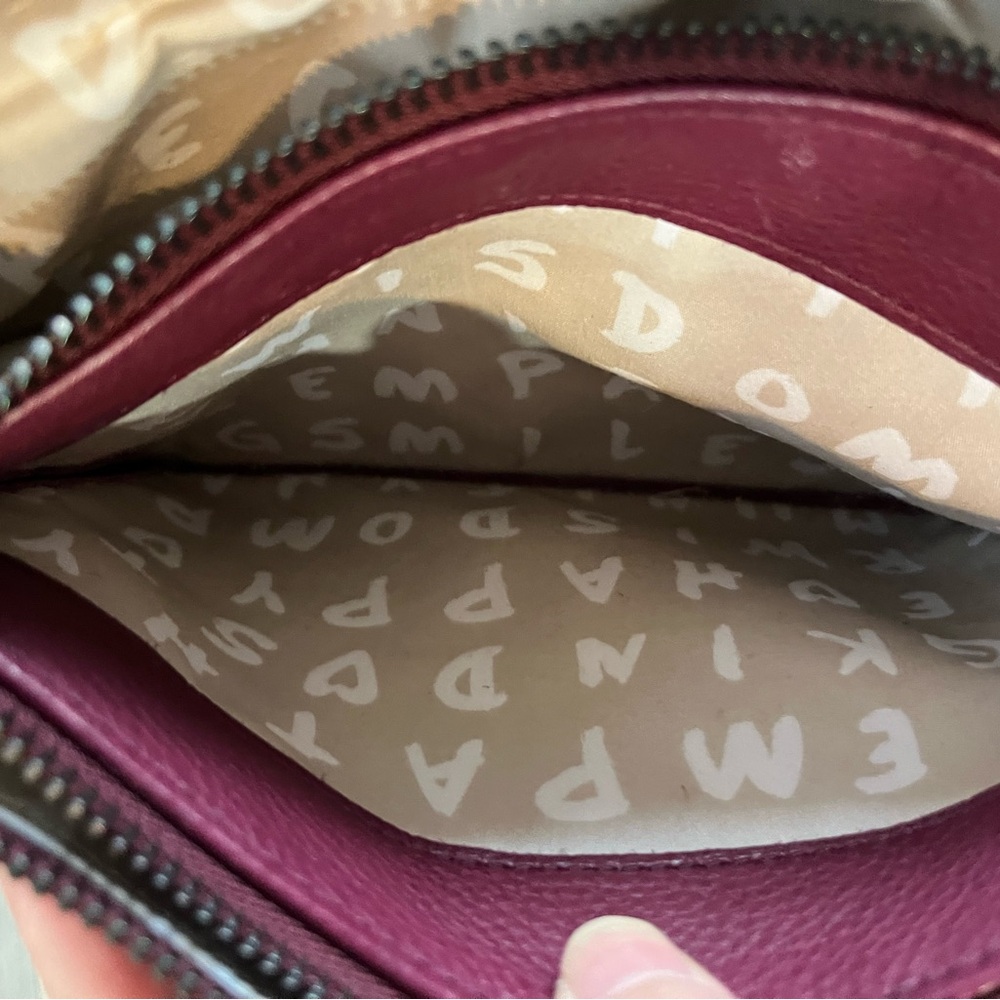 Maroon colored leather crossbody purse in excellent used condition